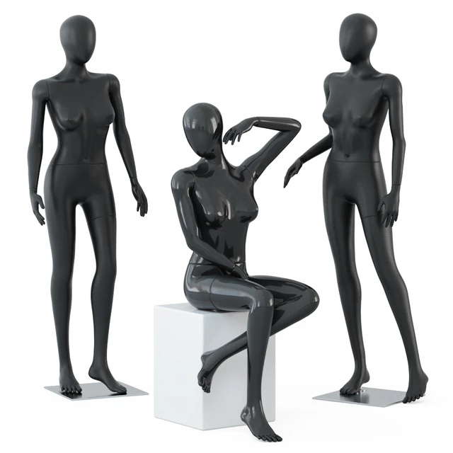 Two female mannequins stand and one sits on a white square stool 58 — Descargar