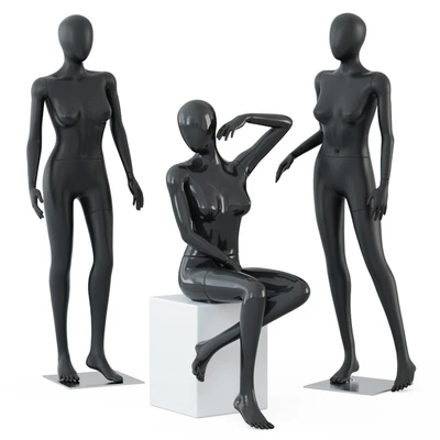 Two female mannequins stand and one sits on a white square stool 58 — Ver 1