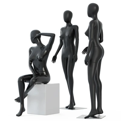 Two female mannequins stand and one sits on a white square stool 58 — Ver 2