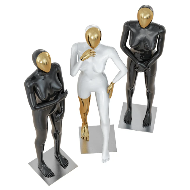 Three female mannequin with a golden face 41 — Скачать