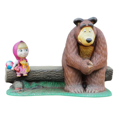 Sculpture of the characters Masha and the bear are sitting on a bench — скачать