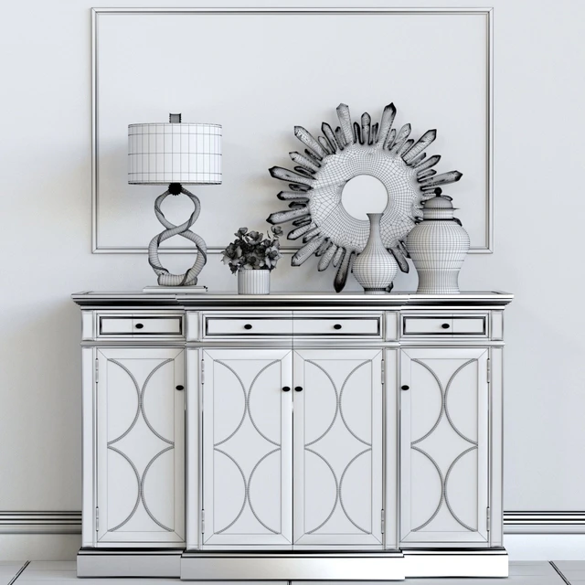 A chest of drawers with a collection of decor, a lamp and a set of sculptures — Descargar