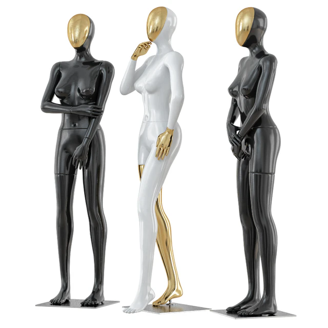 Three female mannequin with a golden face 41 — Скачать