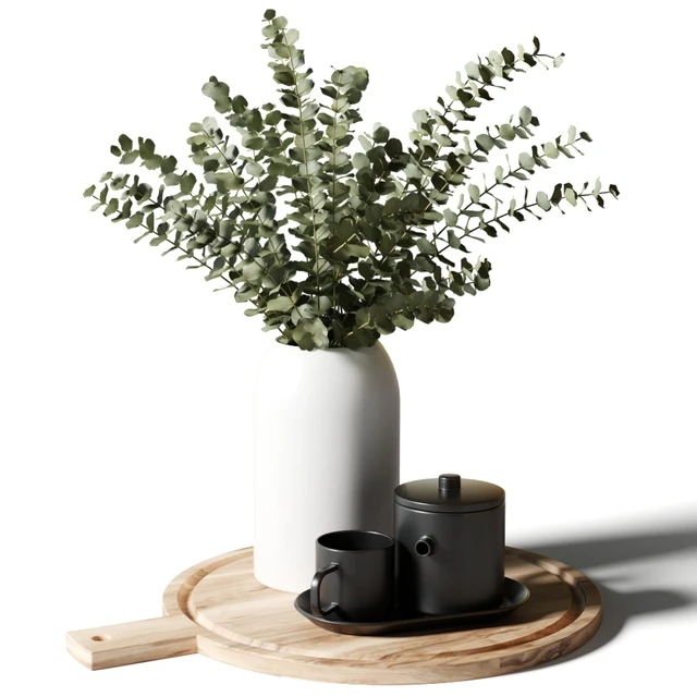 A bouquet of eucalyptus in a white vase, and a teapot with a cup on a wooden board — Download