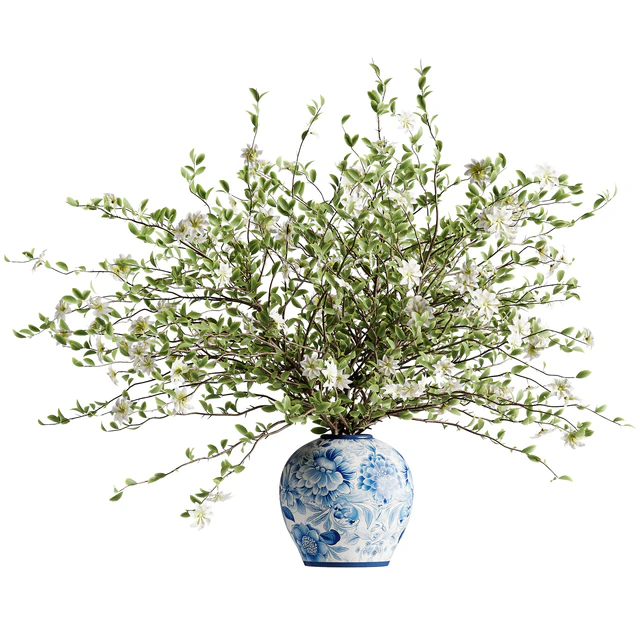 A bouquet of tree branches inserted into a celadon ceramic pot — Descargar